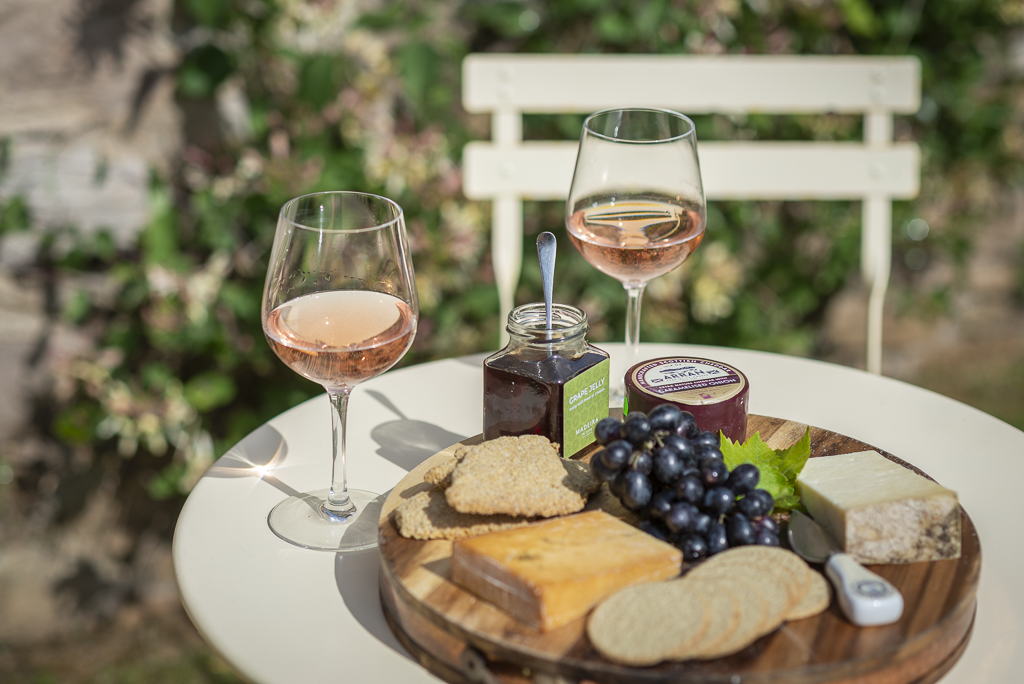 cheese and cracker platter with wine 